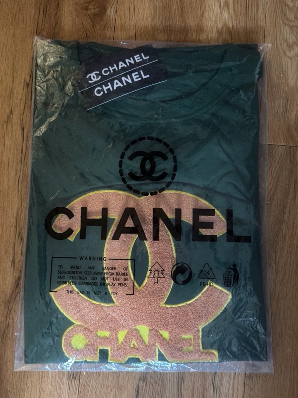 CHANEL Dark Green Tee with Contrasting Yellow-Pink Logo